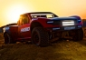  Радиоуправляемый шорт-корс Traxxas Unlimited Desert Racer 1:7 RTR (красный, свет в стоке)