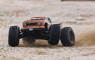 Монстр ARRMA 1:10 OUTCAST 4x4 4S BLX Brushless Stunt Truck with Spektrum RTR, Bronze