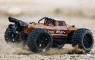 Монстр ARRMA 1:10 OUTCAST 4x4 4S BLX Brushless Stunt Truck with Spektrum RTR, Bronze
